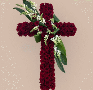 Red Rose Cross with White Snapdragons and Tropical Leaf Accents